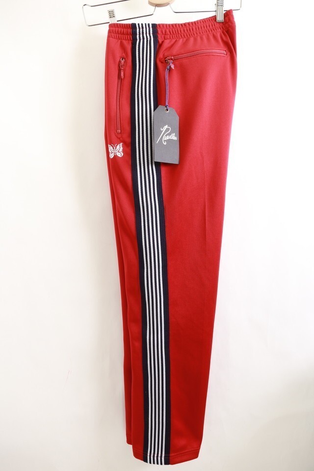 needles track pants red