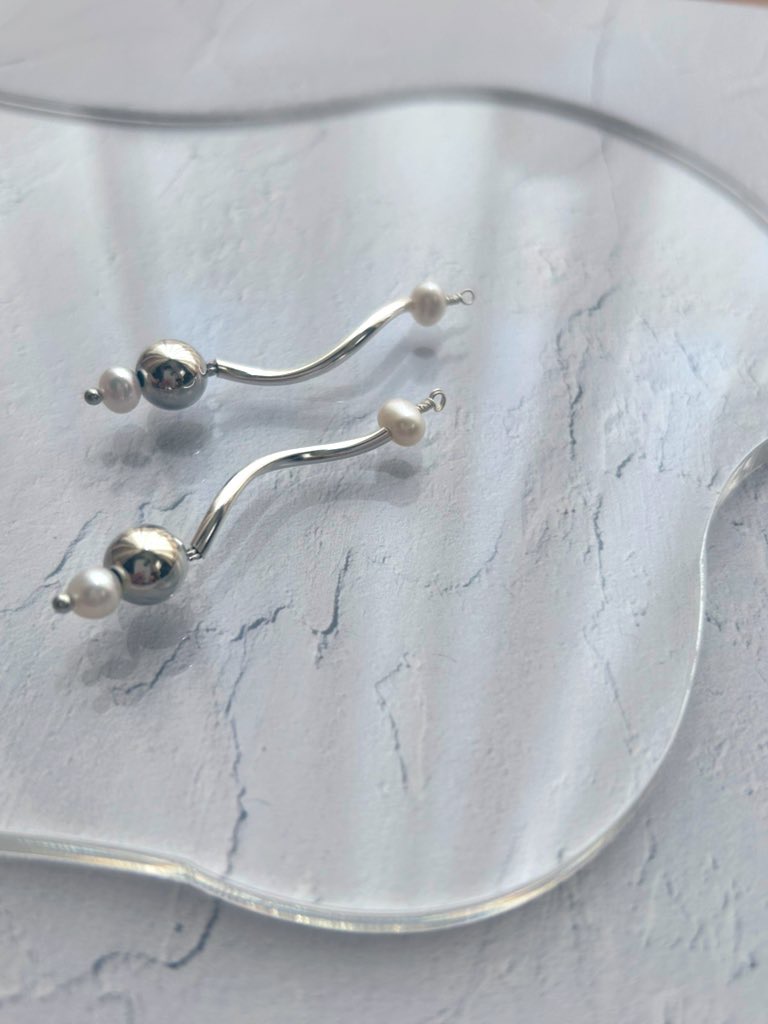 波のあと、しずくひとつ