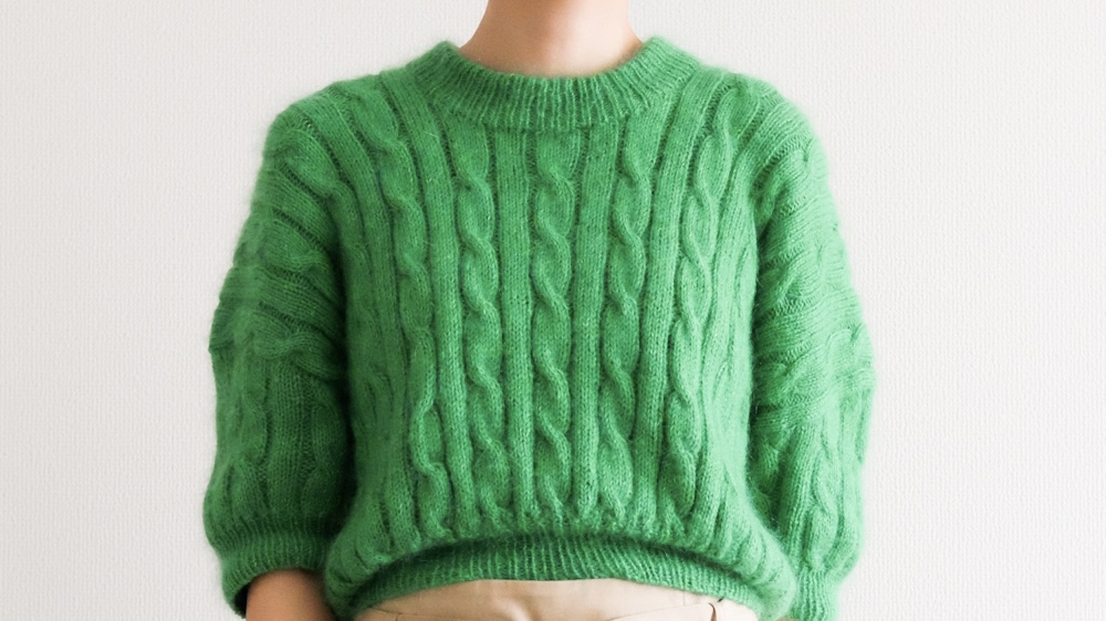 Green cable sweater