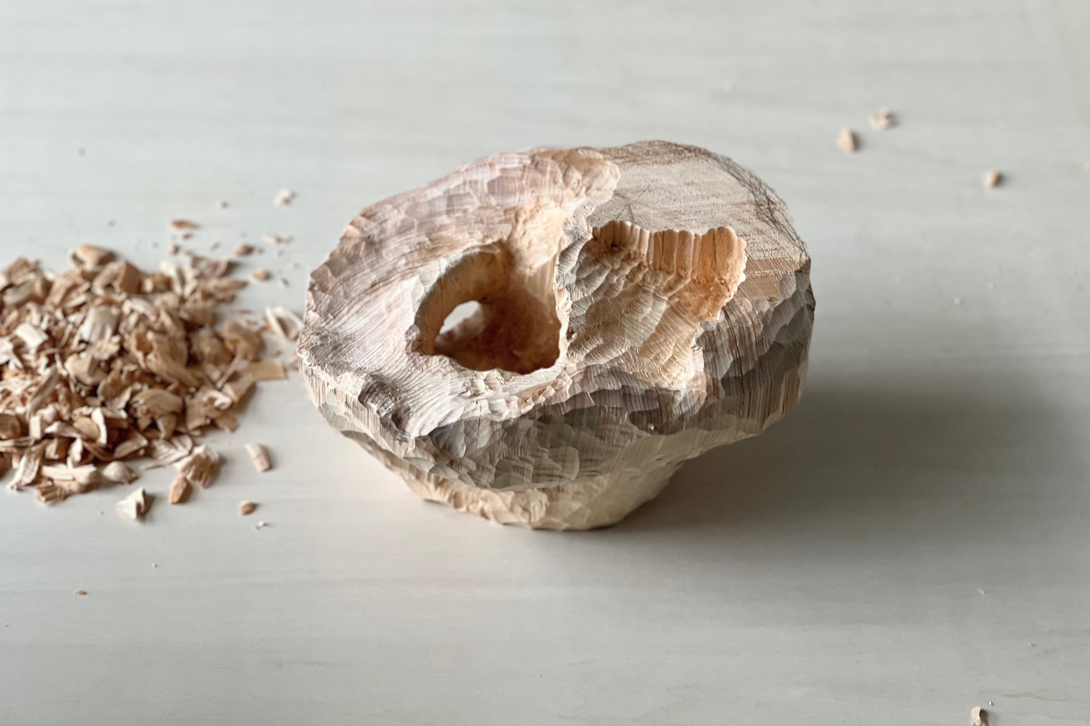 Wood grain begins to appear on the surface